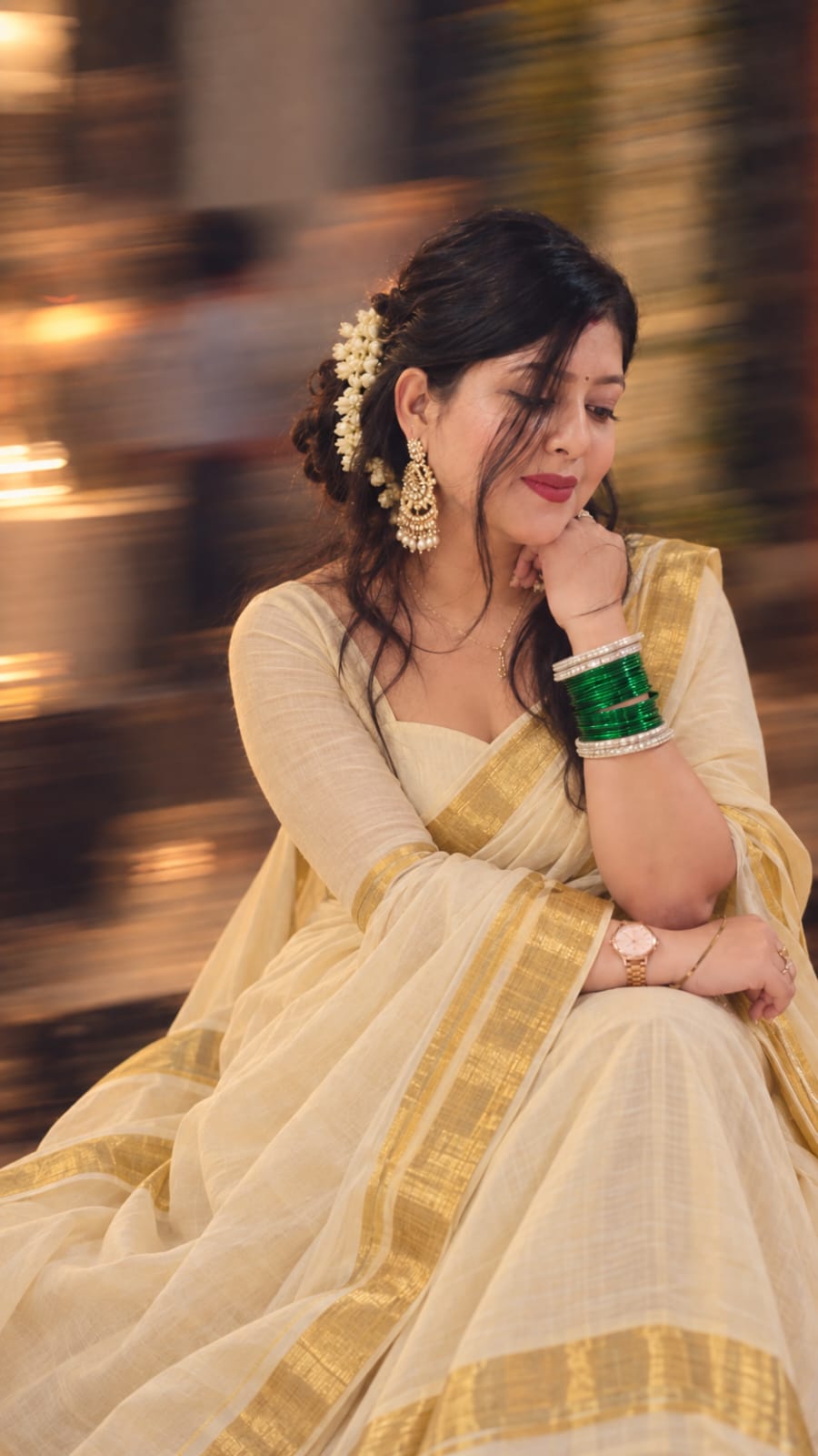Vartika in a graceful ivory and gold saree